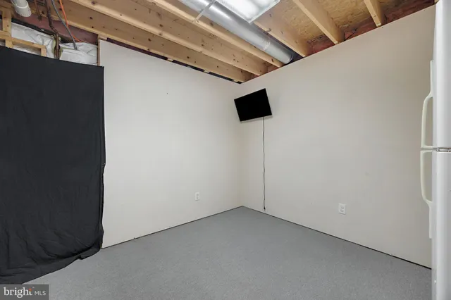 a view of a deck with wooden floor and fence with a wooden fence