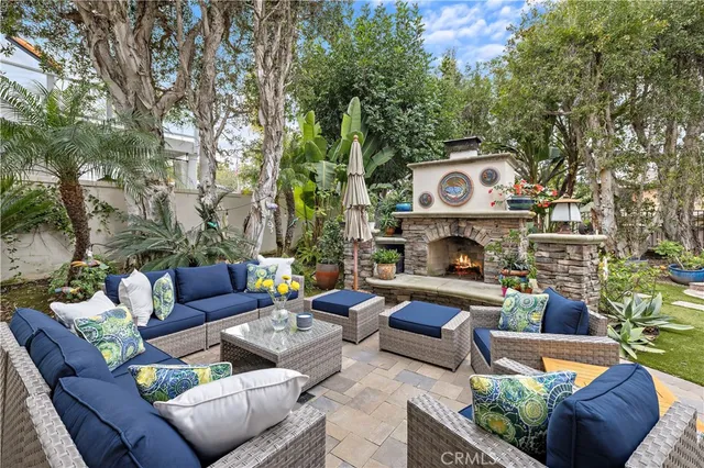 a outdoor living space with furniture and a fireplace