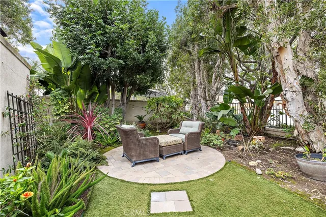 a view of a backyard with sitting area
