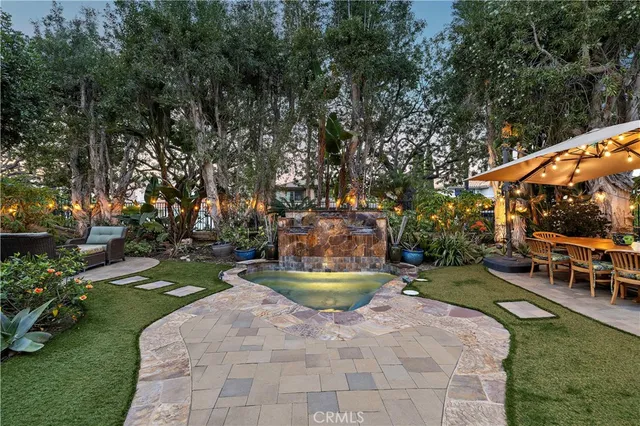 a view of a backyard with sitting area