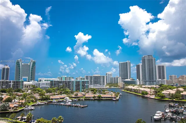 a view of a city with tall trees
