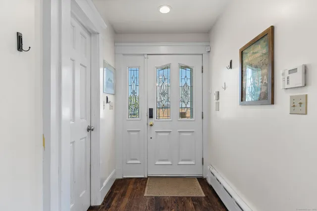 a view of room with window and hardwood floor