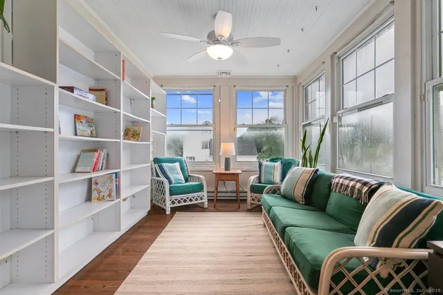 a living room with furniture and a rug