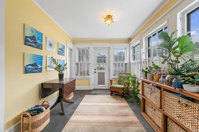 a lobby with furniture and rug
