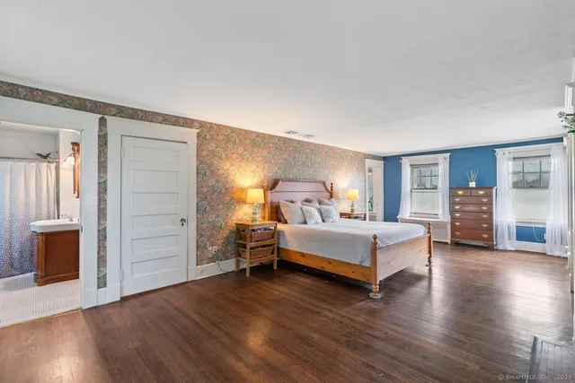 a bed room with bed and a window