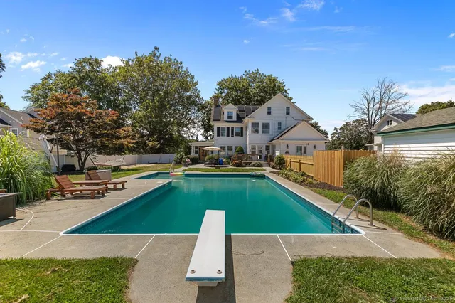 a view of swimming pool with lounge chair