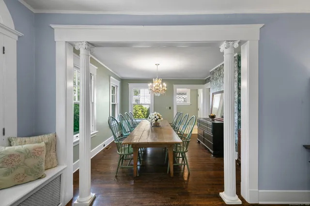 a dining room with furniture and window