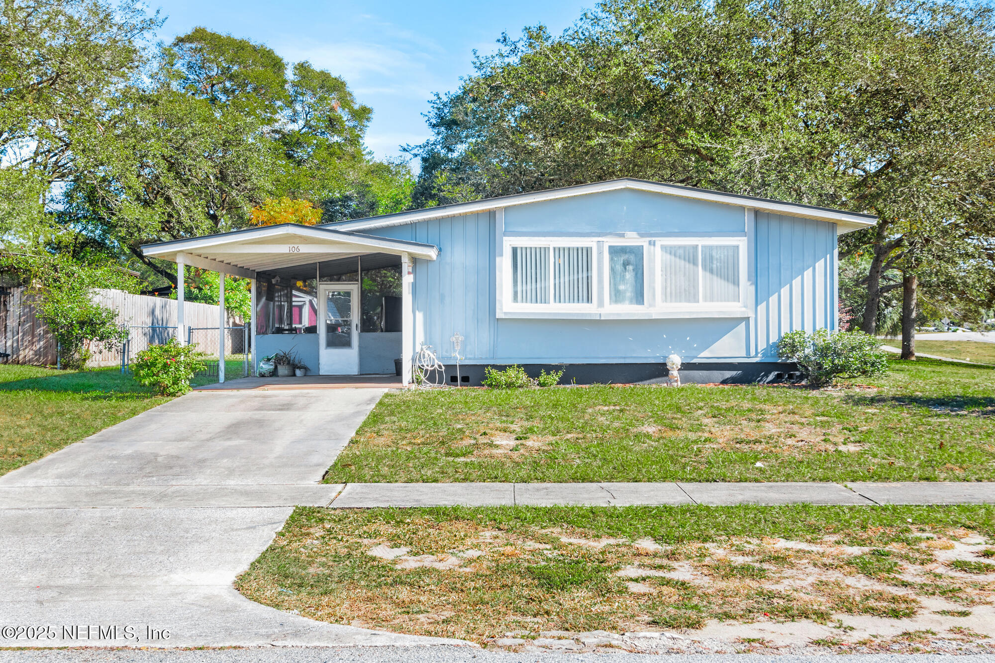 106 Deltona Boulevard St. Augustine, FL 32086 - Photo 22 of 36 a view of a house with a yard patio and a garden