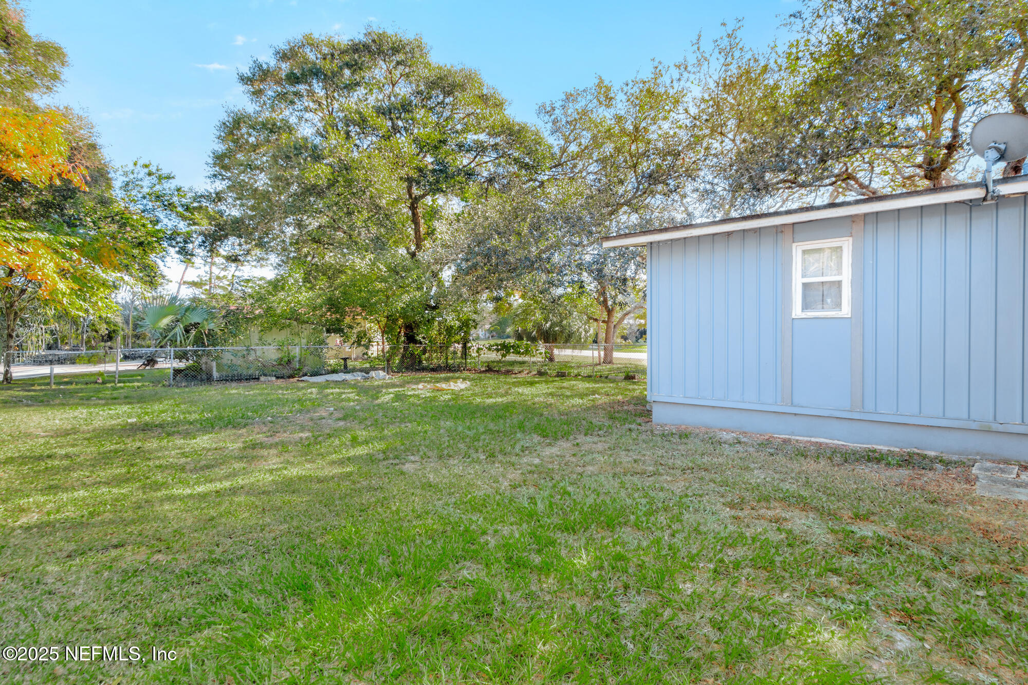 106 Deltona Boulevard St. Augustine, FL 32086 - Photo 25 of 36 a view of outdoor space with deck and yard