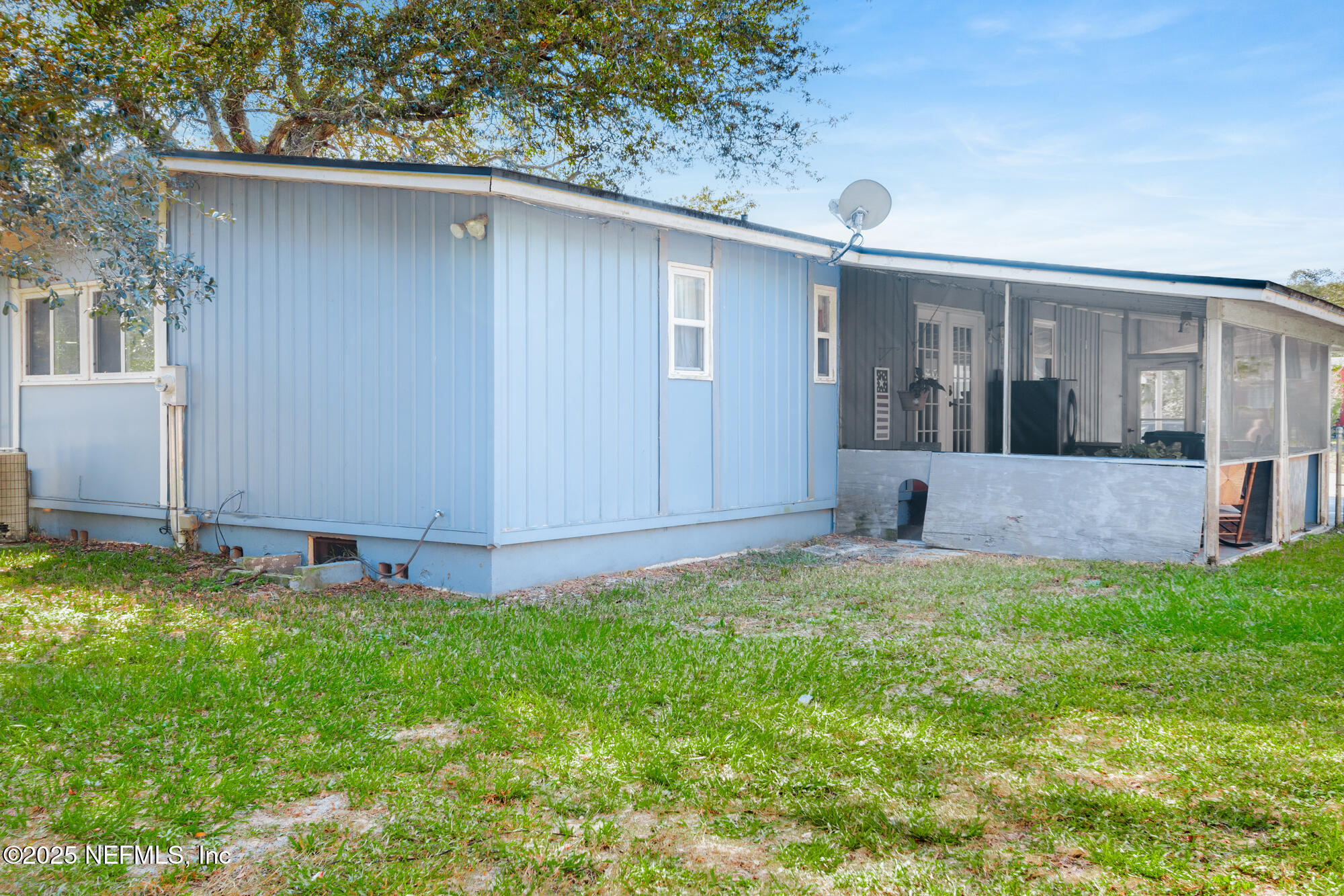 106 Deltona Boulevard St. Augustine, FL 32086 - Photo 28 of 36 a view of a house with backyard and garden