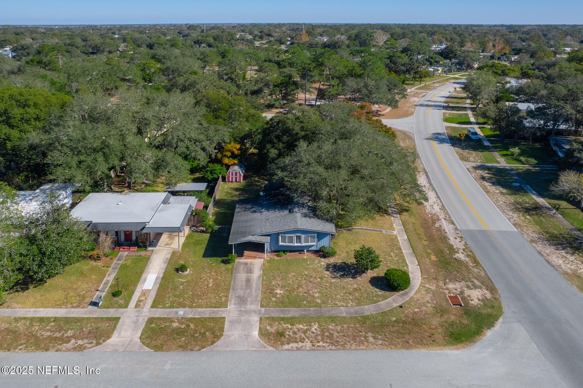 106 Deltona Boulevard St. Augustine, FL 32086 - Photo 31 of 36 an aerial view of a house with a yard