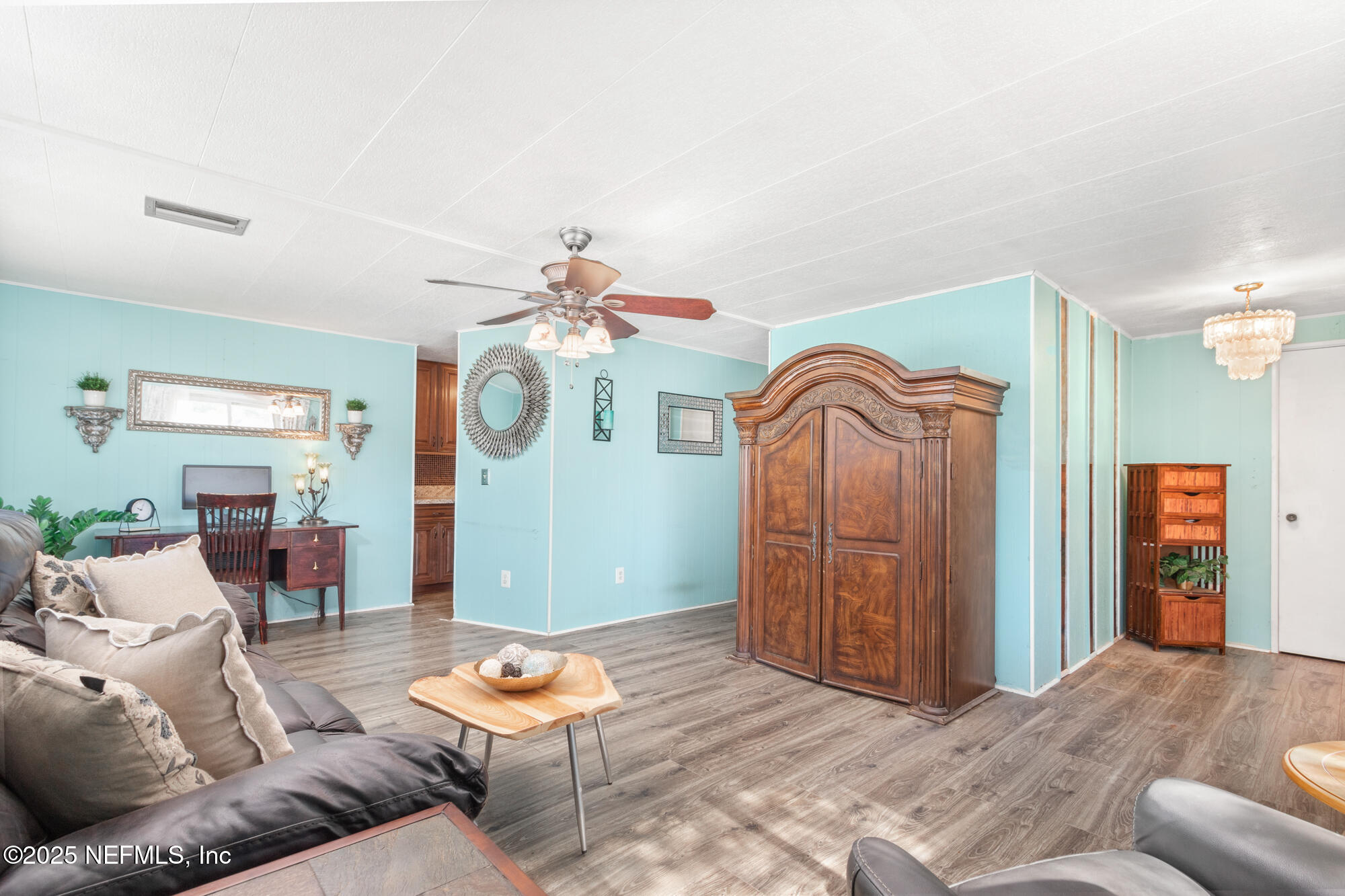 106 Deltona Boulevard St. Augustine, FL 32086 - Photo 4 of 36 a living room with furniture and wooden floor