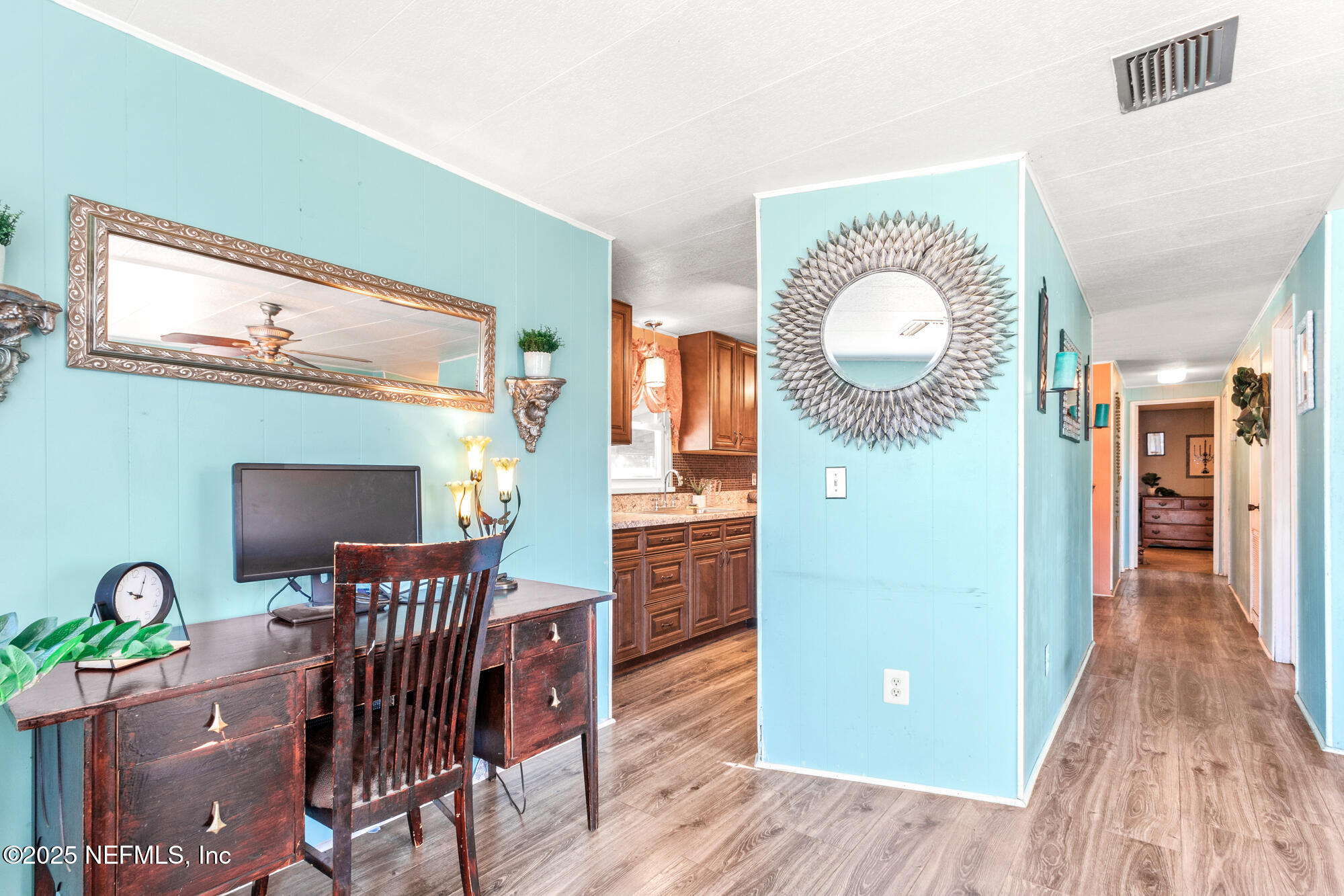 106 Deltona Boulevard St. Augustine, FL 32086 - Photo 5 of 36 a view of a dining room with furniture and wooden floor