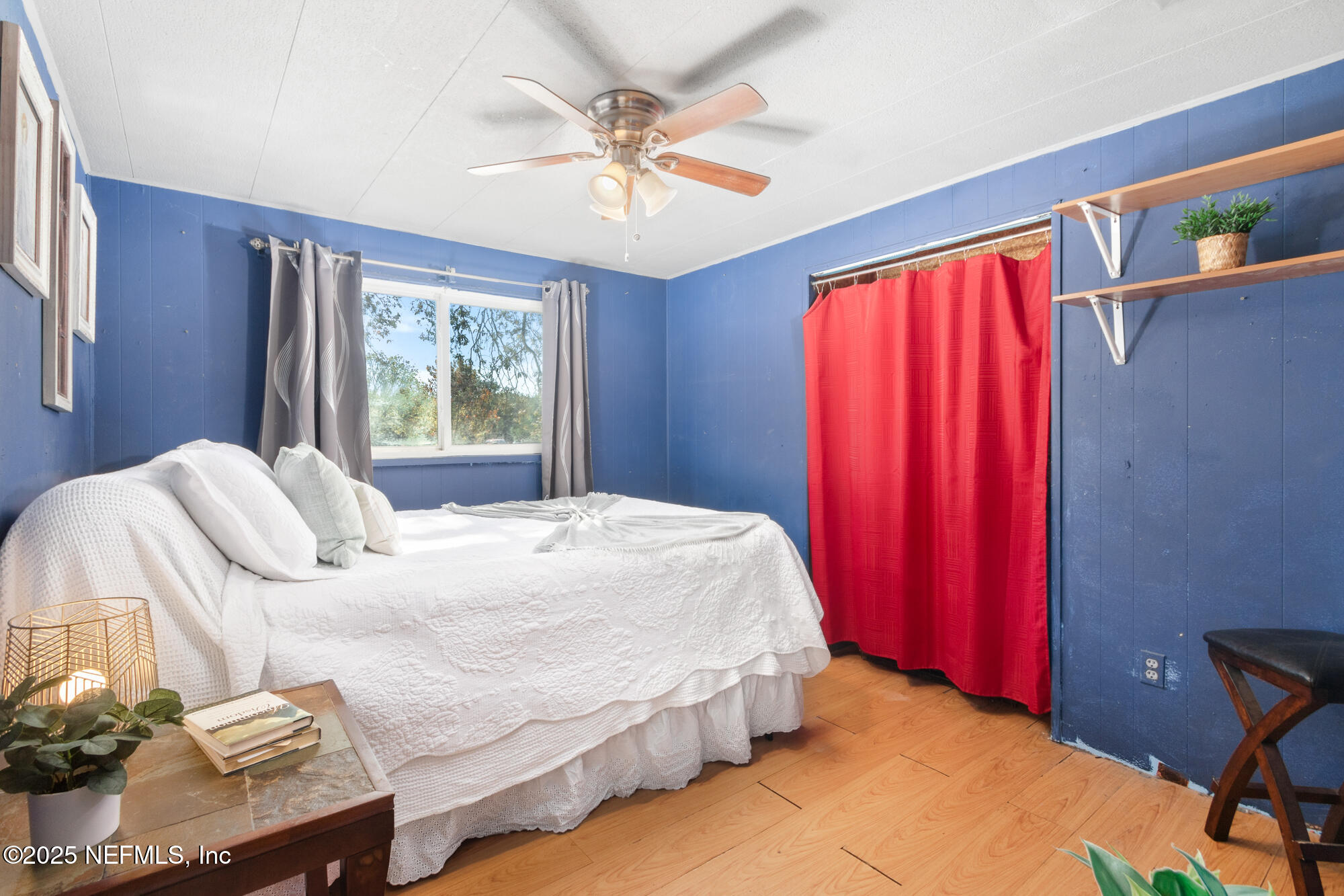 106 Deltona Boulevard St. Augustine, FL 32086 - Photo 6 of 36 a bedroom with a bed and a chandelier