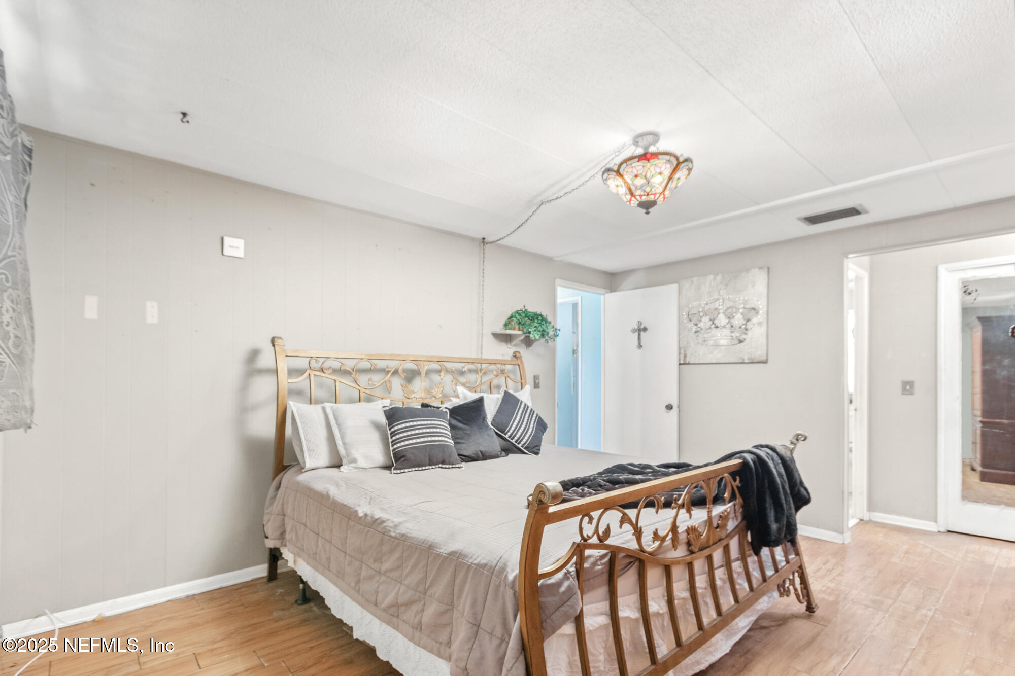 106 Deltona Boulevard St. Augustine, FL 32086 - Photo 9 of 36 a bedroom with a bed and a window