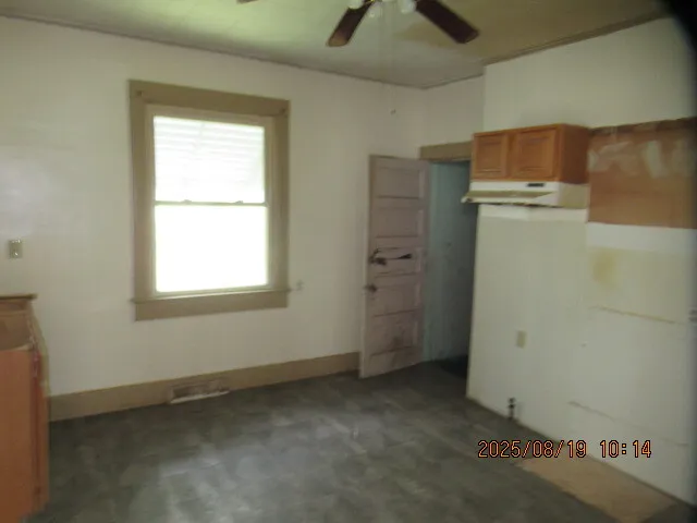 a bathroom with a window and a door