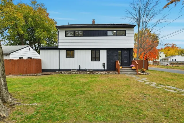a front view of a house with a yard