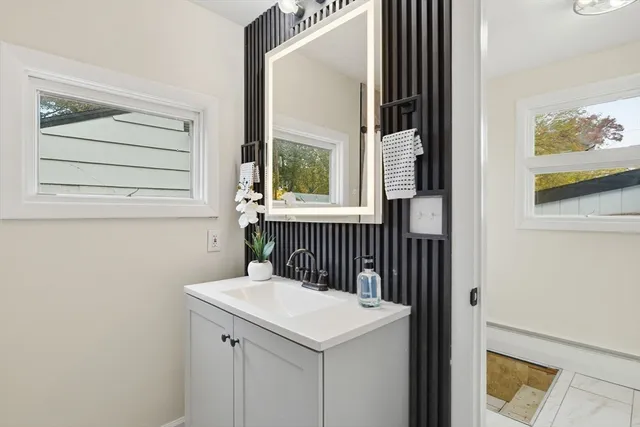a bathroom with a sink and a mirror