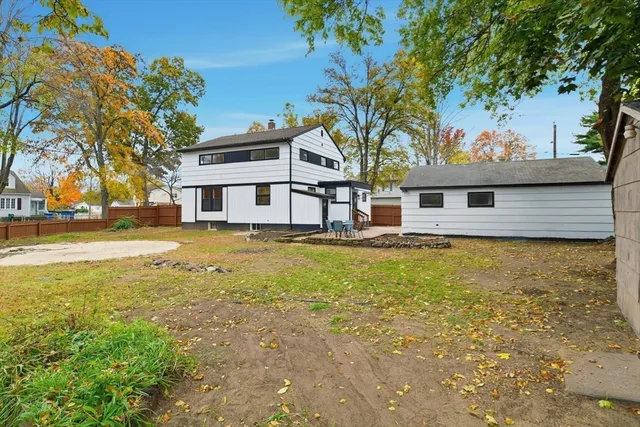 a front view of a house with a big yard
