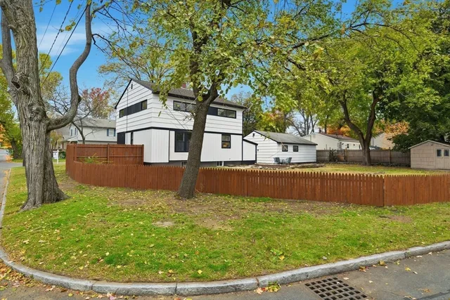 a view of a house with a yard