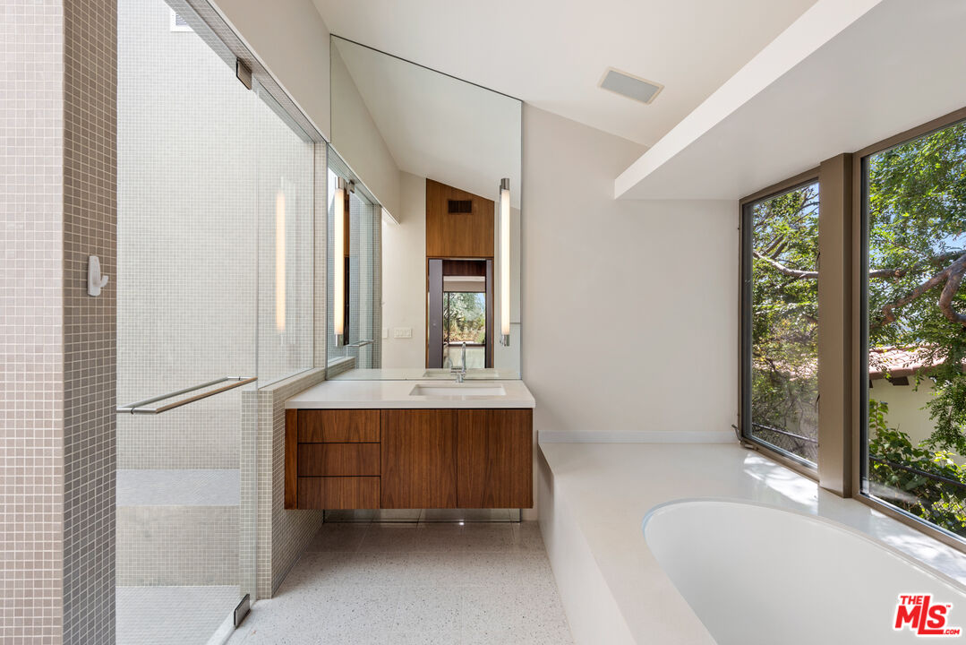 Undisclosed Address Los Angeles, CA 90068 - Photo 15 of 30 a bathroom with a tub sink and mirror