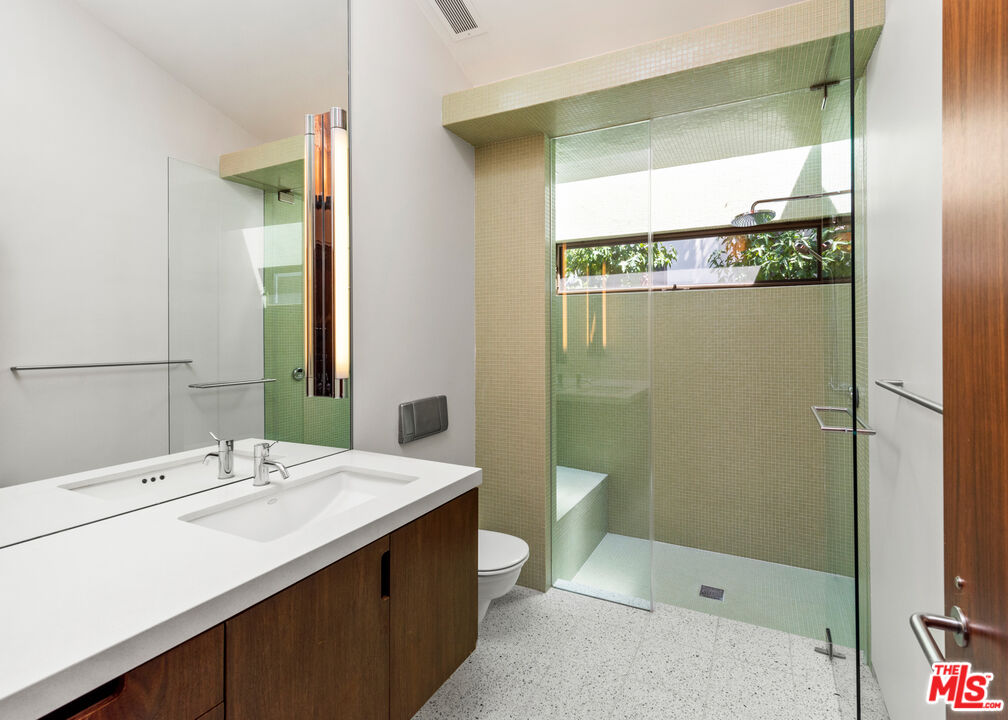 Undisclosed Address Los Angeles, CA 90068 - Photo 19 of 30 a bathroom with a sink a toilet and shower