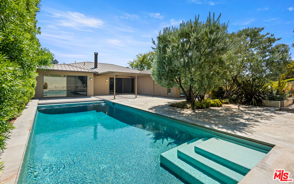 Undisclosed Address Los Angeles, CA 90068 - Photo 21 of 30 a front view of a house with garden