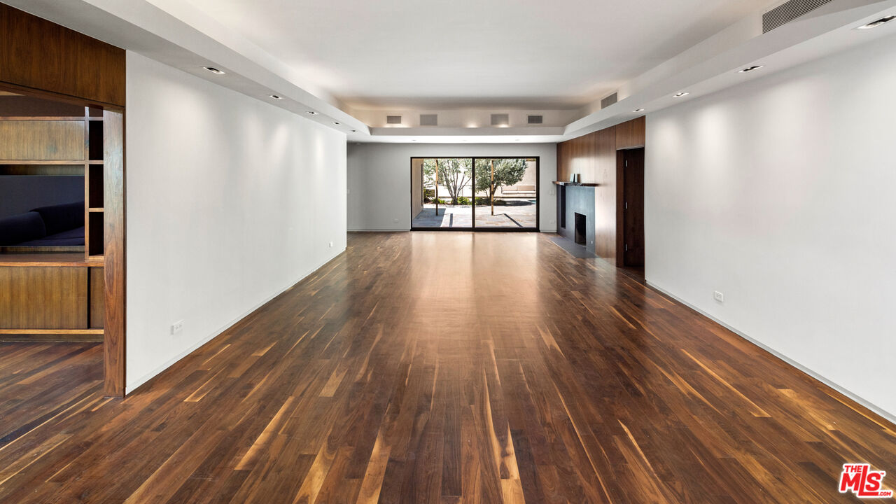 Undisclosed Address Los Angeles, CA 90068 - Photo 4 of 30 a view of an empty room with wooden floor and a window