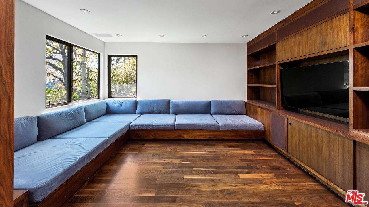 Undisclosed Address Los Angeles, CA 90068 - Photo 5 of 30 a living room with a couch and a flat screen tv