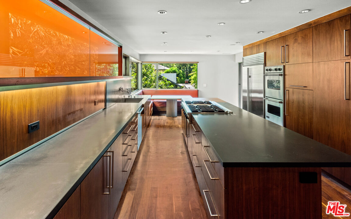 Undisclosed Address Los Angeles, CA 90068 - Photo 8 of 30 a kitchen with kitchen island granite countertop a sink a counter top space and stainless steel appliances