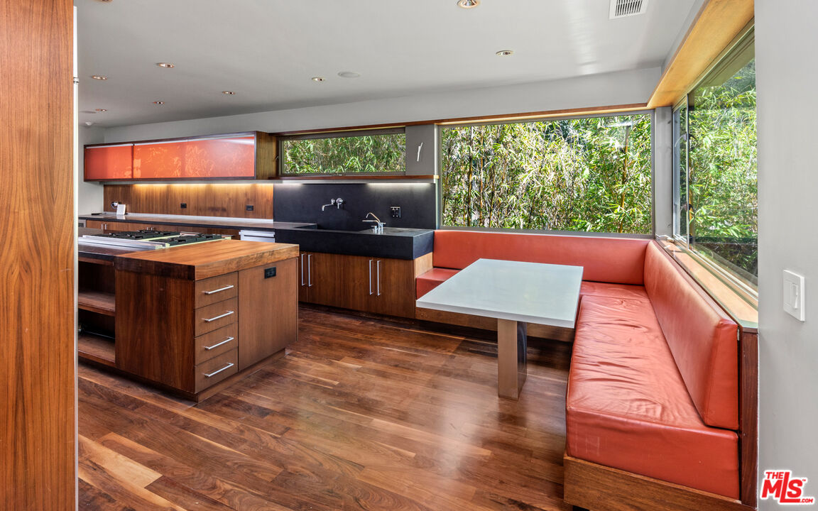 Undisclosed Address Los Angeles, CA 90068 - Photo 10 of 30 a kitchen with stainless steel appliances granite countertop a stove and a wooden cabinets