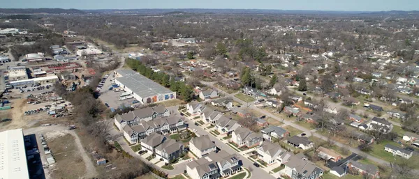 an aerial view of a house with a yard