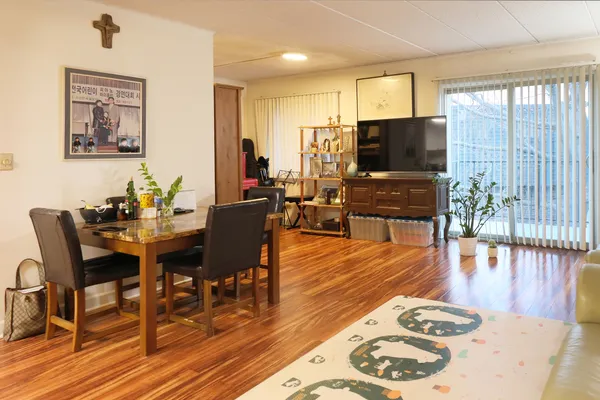 a view of a dining room with furniture window and wooden floor