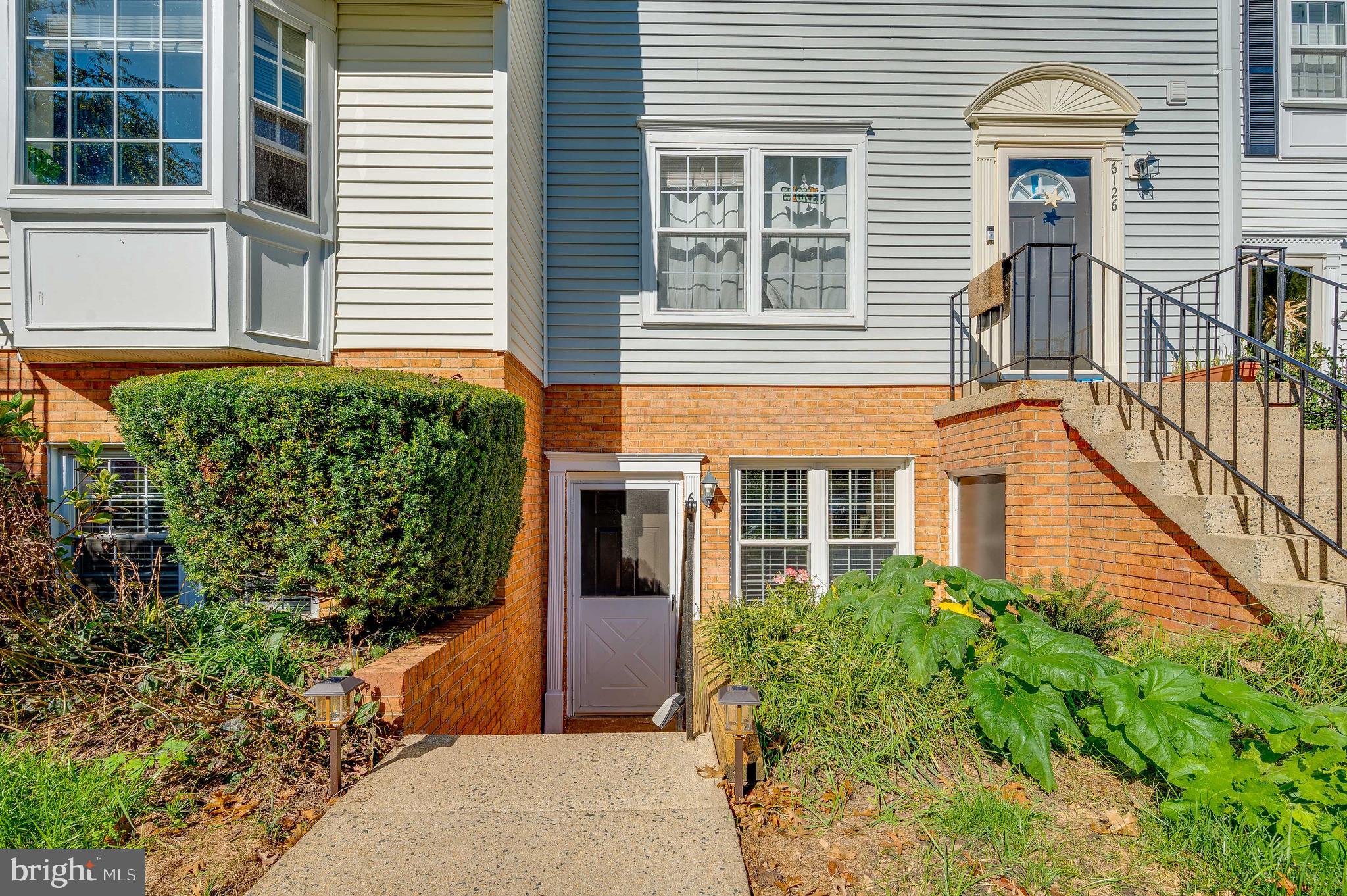 6128 Old Landing Way, Unit 75 Burke, VA 22015 - Photo 1 of 25 front view of a house