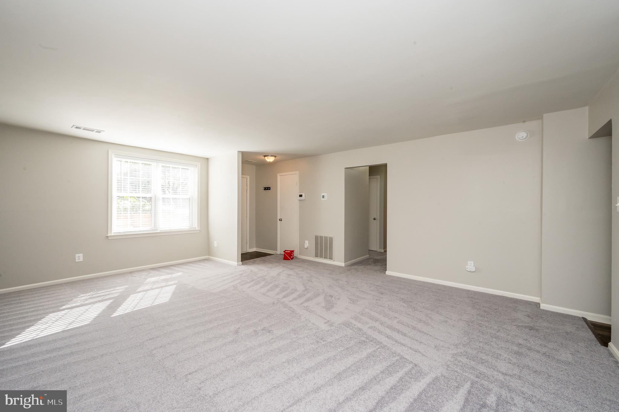 6128 Old Landing Way, Unit 75 Burke, VA 22015 - Photo 13 of 25 a view of an empty room with a window