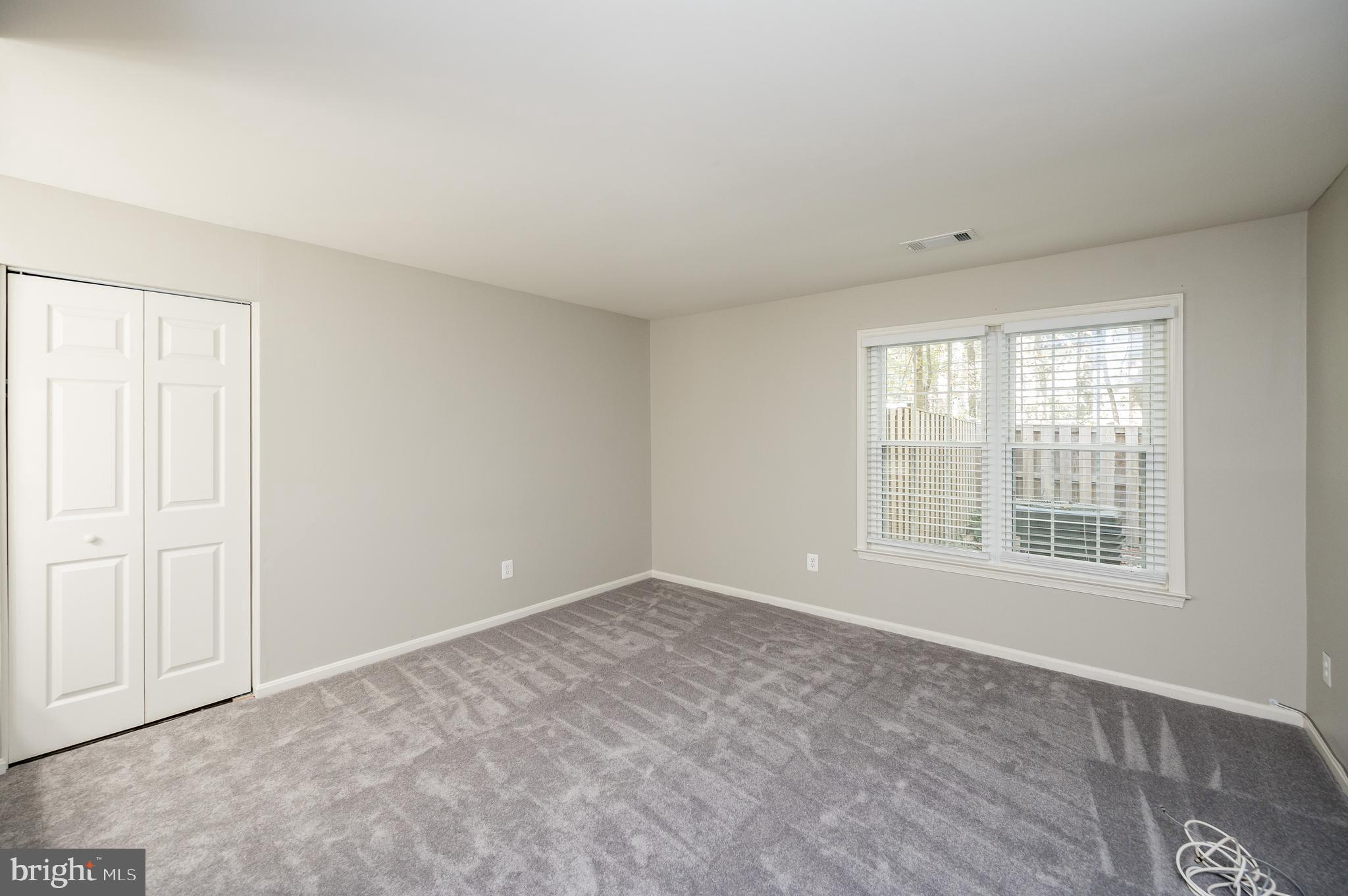 6128 Old Landing Way, Unit 75 Burke, VA 22015 - Photo 21 of 25 an empty room with windows