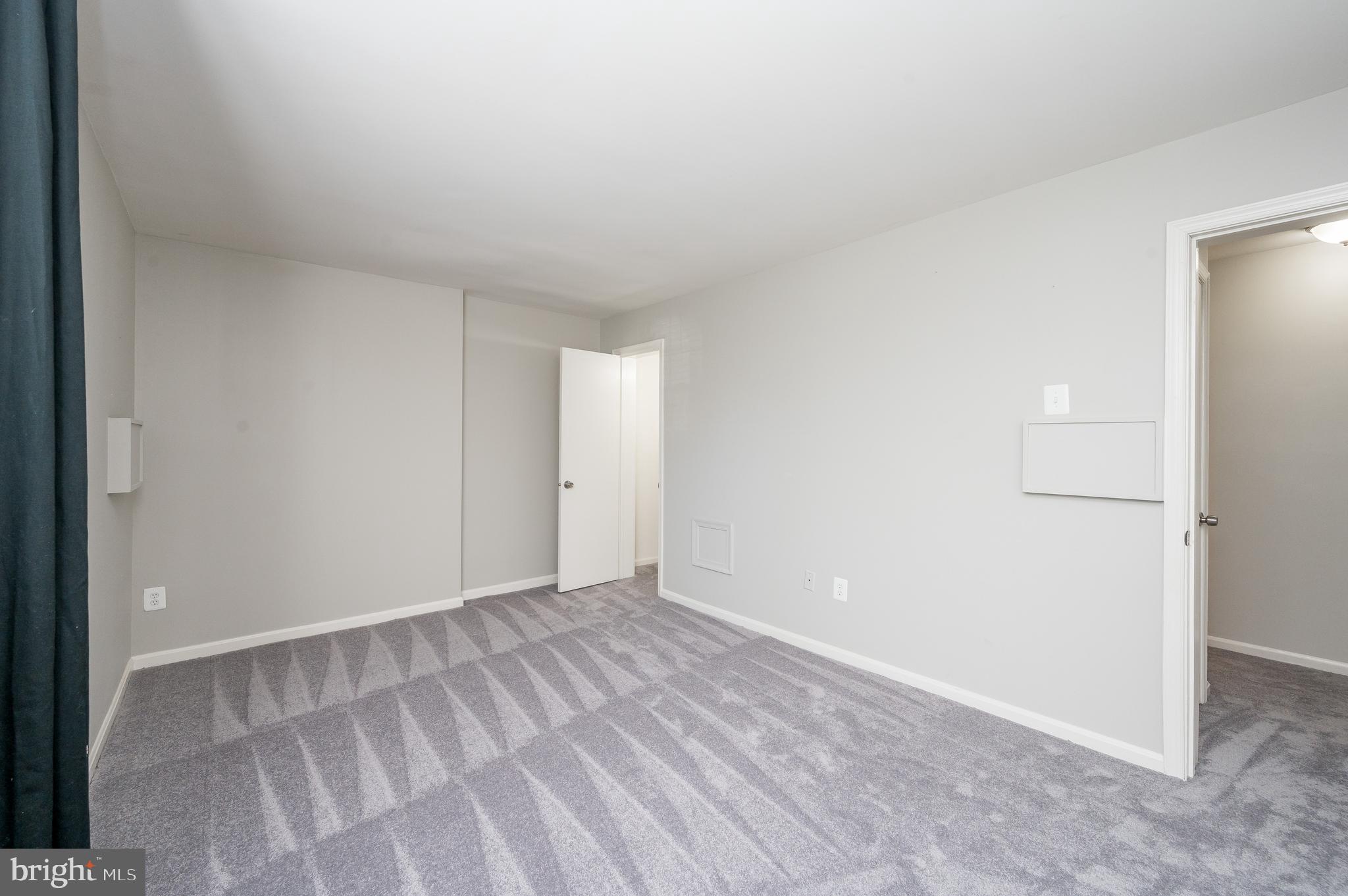 6128 Old Landing Way, Unit 75 Burke, VA 22015 - Photo 23 of 25 a view of an empty room and window
