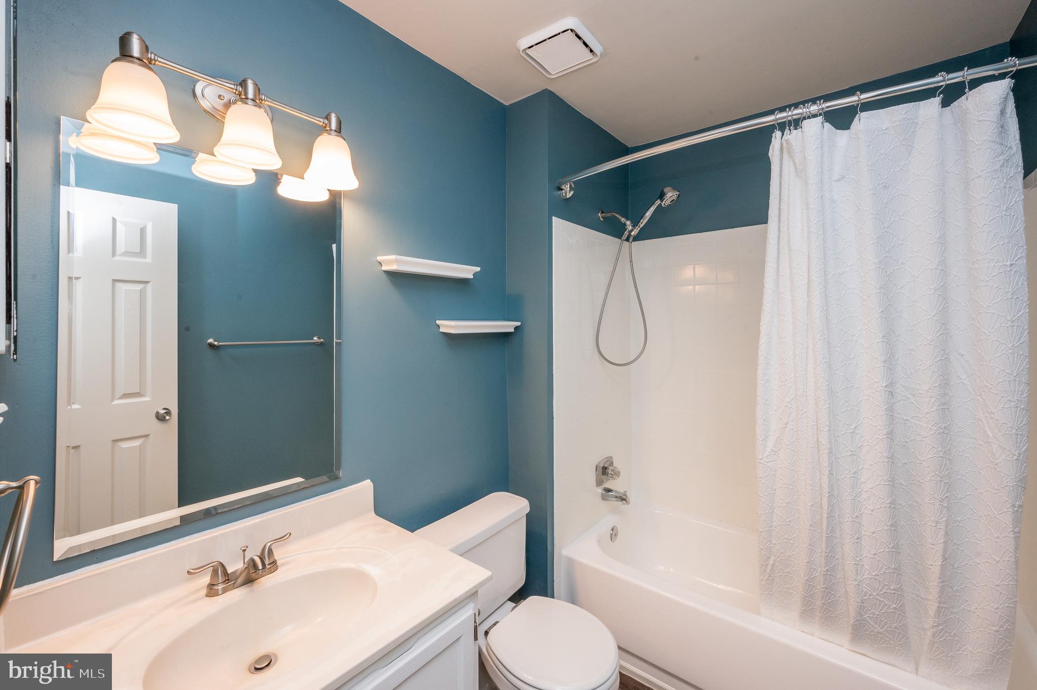 6128 Old Landing Way, Unit 75 Burke, VA 22015 - Photo 4 of 25 a bathroom with a sink toilet and shower