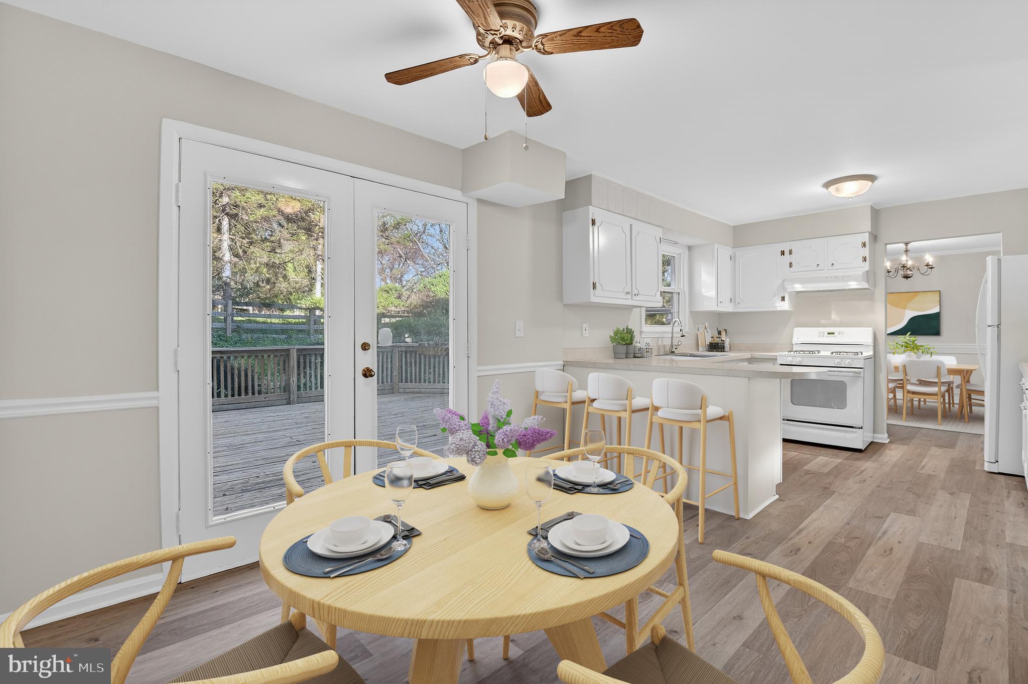 14121 Ansted Road Silver Spring, MD 20905 - Photo 8 of 42 Table space kitchen with French doors onto deck