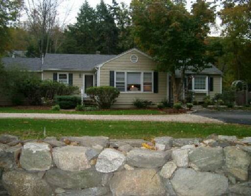 45 Dudley Road Wilton, CT 06897 - Photo 1 of 1 a front view of a house with garden