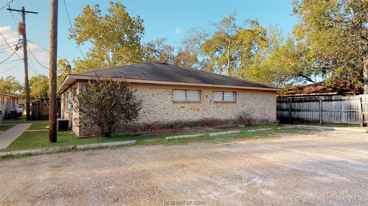 204 Lynn Drive, Unit B Bryan, TX 77801 - Photo 17 of 17 a view of a house with a yard and tree