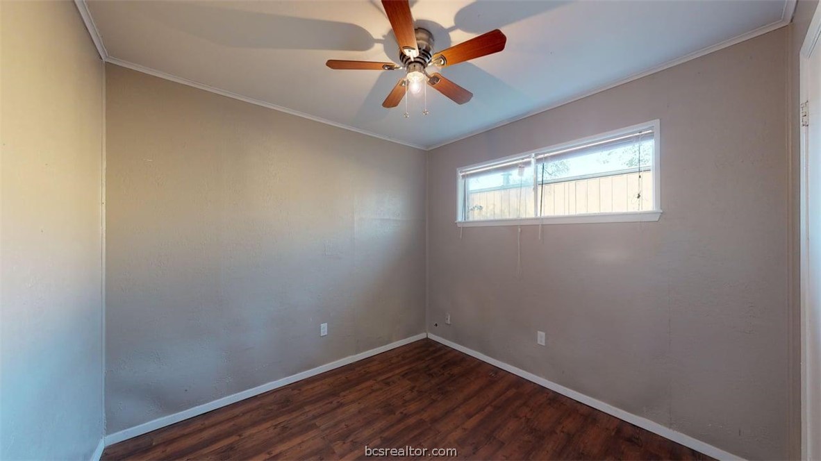 204 Lynn Drive, Unit B Bryan, TX 77801 - Photo 7 of 17 an empty room with windows and fan