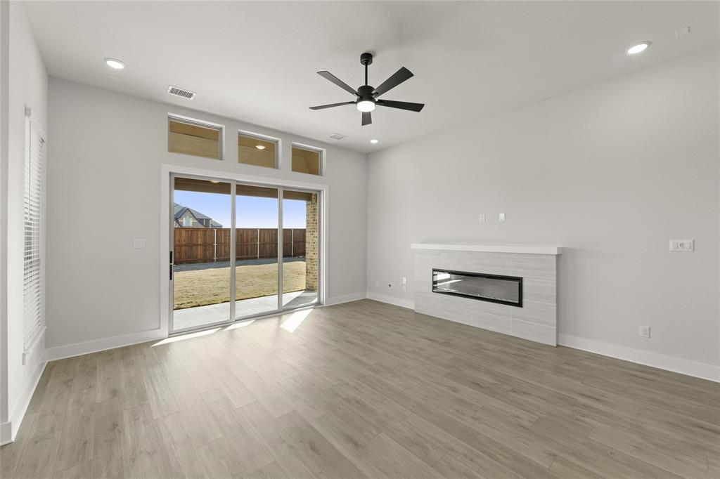 1503 Robinson Road Forney, TX 75126 - Photo 14 of 34 wooden floor in an empty room with a window