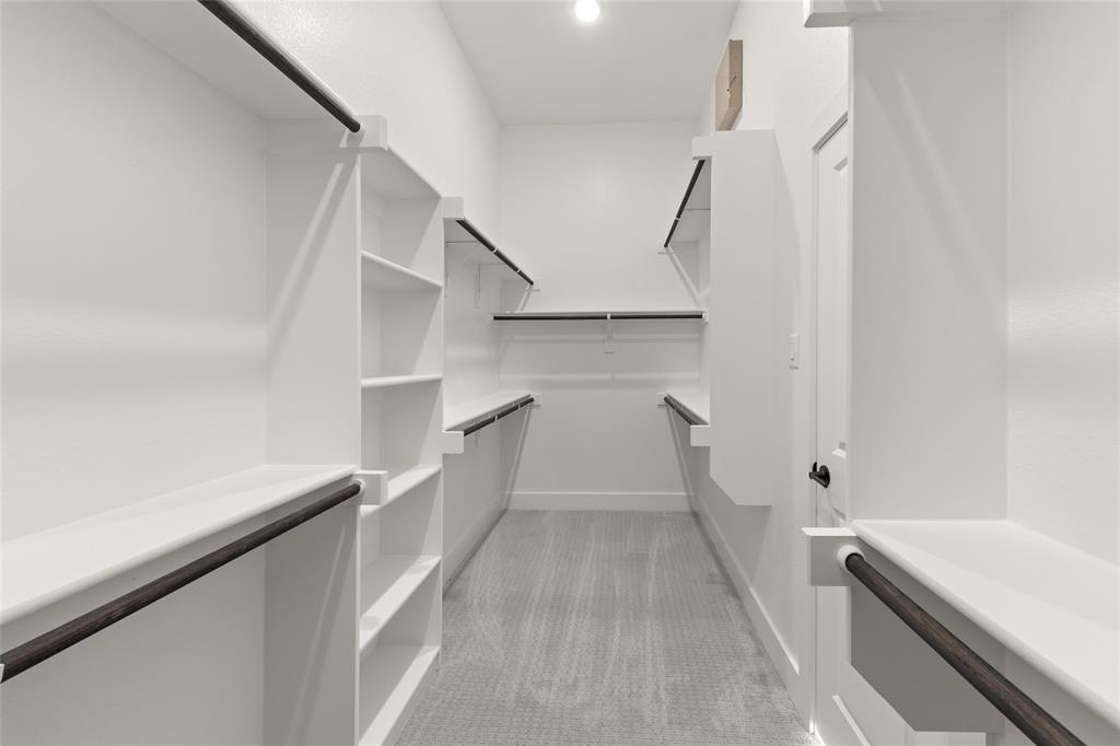 1503 Robinson Road Forney, TX 75126 - Photo 19 of 34 a view of walk in closet with empty racks