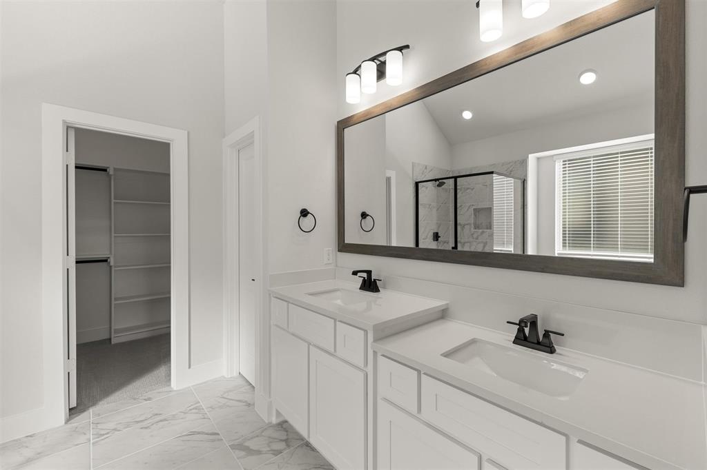 1503 Robinson Road Forney, TX 75126 - Photo 24 of 34 a bathroom with a sink and a mirror