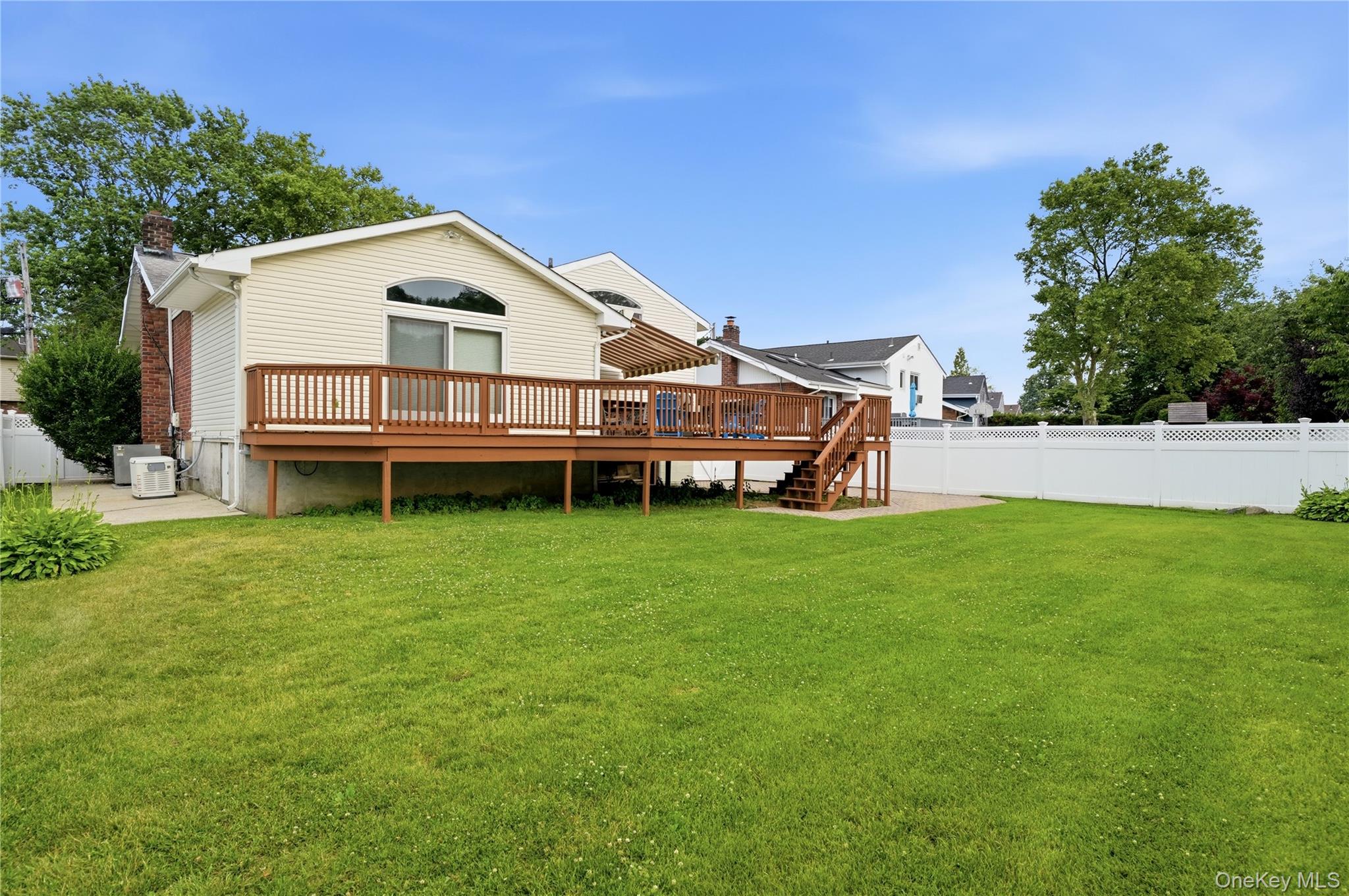 1853 Decatur Avenue Merrick, NY 11566 - Photo 34 of 43 a view of a house with a yard and deck
