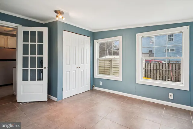 a view of a big room with closet and chandelier fan