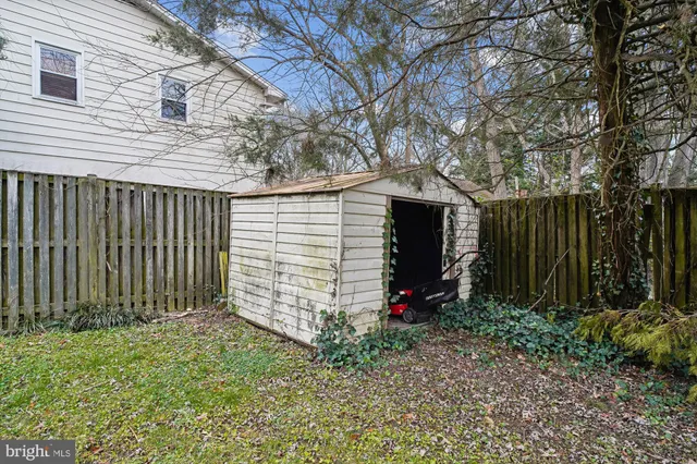 a view of a lake with boats and trees in the background