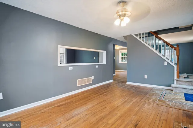 a kitchen with granite countertop white cabinets and stainless steel appliances