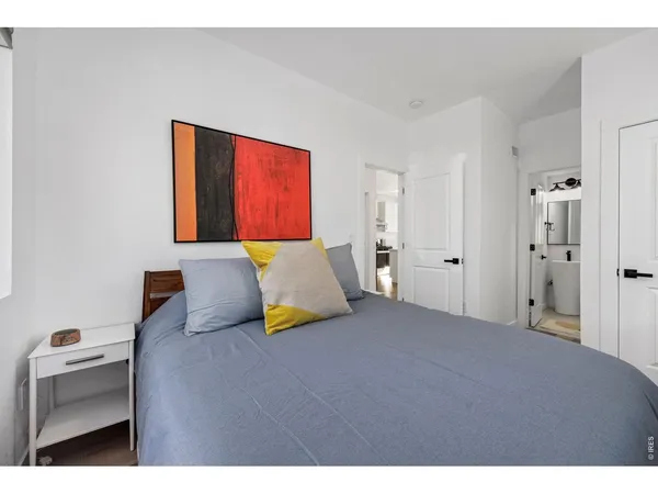 a bedroom with a bed and a couch